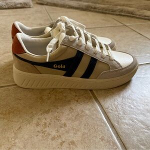 Gola Beige Sneakers with Navy Stripes and Orange Heel Accent